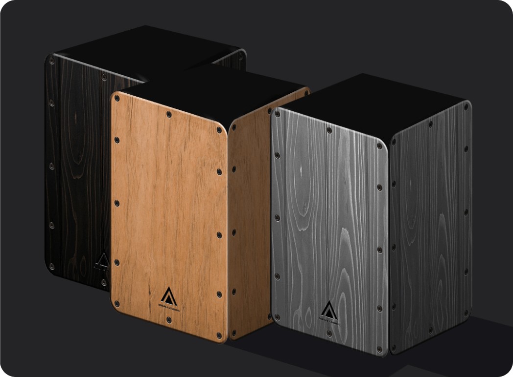 3 Real Cajon's from the Real Cajon app placed side by side, dark wood on the left, orangish wood in the middle and grey on the right