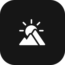 icon of a mountian with sun behind it